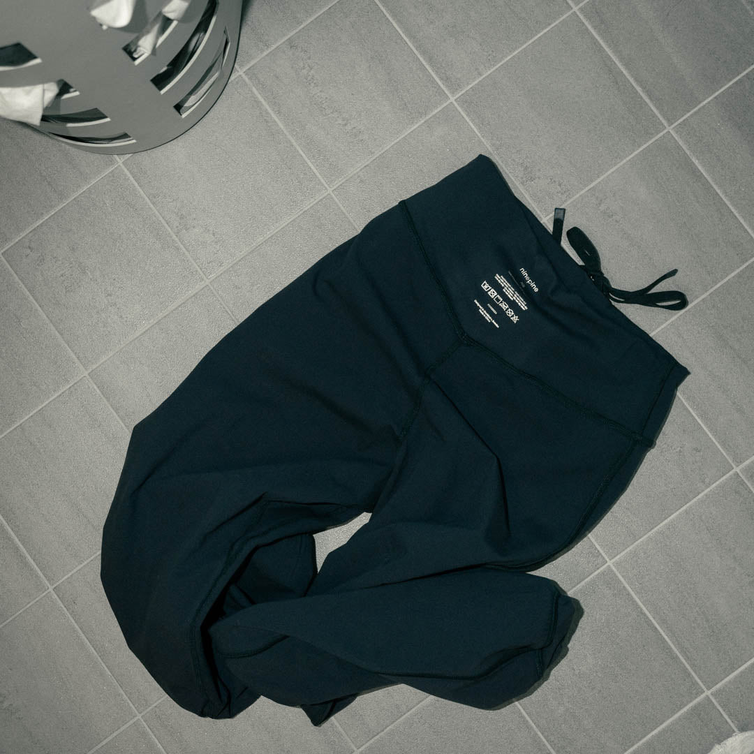 Inside out activewear joggers on bathroom floor