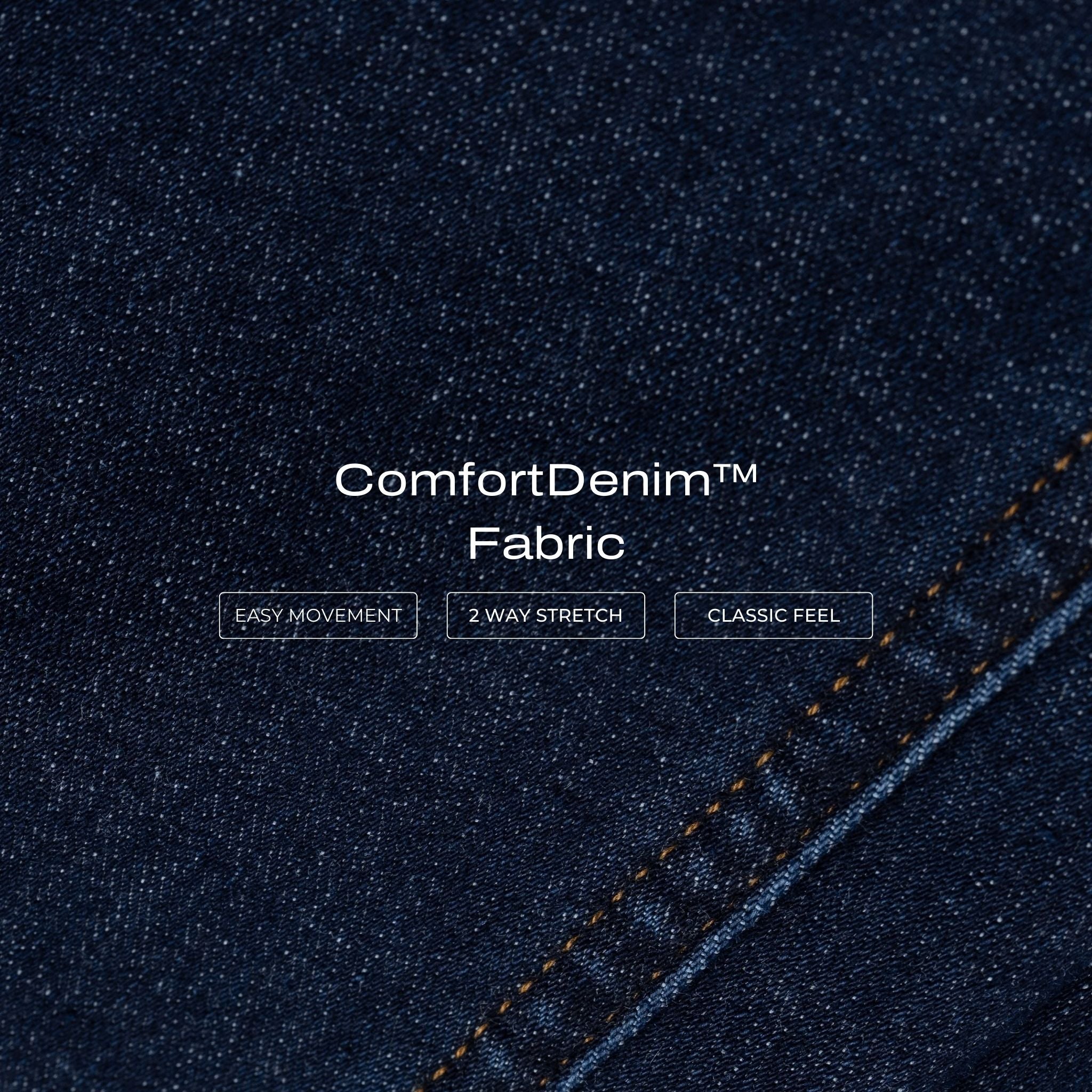 Close-up of dark blue Ninepine ComfortDenim fabric texture with visible stitching.