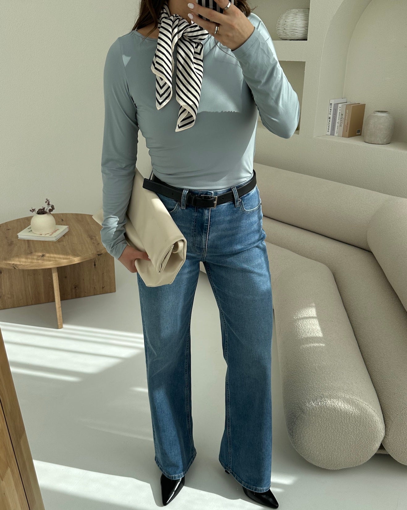 Woman wearing Ninepine Relaxed ComfortDenim™ jeans in Vintage Blue with a relaxed straight-leg silhouette and casual everyday styling.